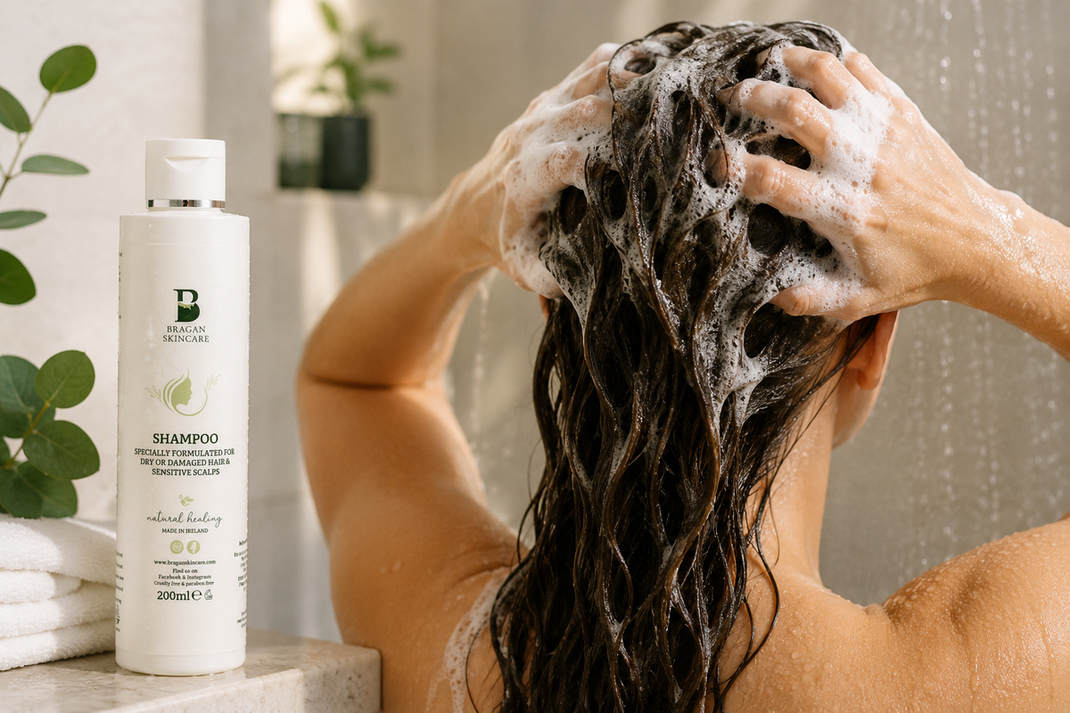 Person washing their hair with Bragan Skincare Shampoo for sensitive scalps as part of a gentle seborrheic dermatitis scalp care routine.