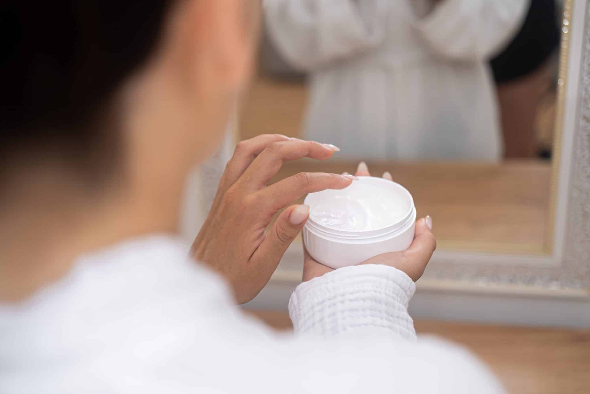 woman uses Anti-Ageing Snail Mucin Face Cream