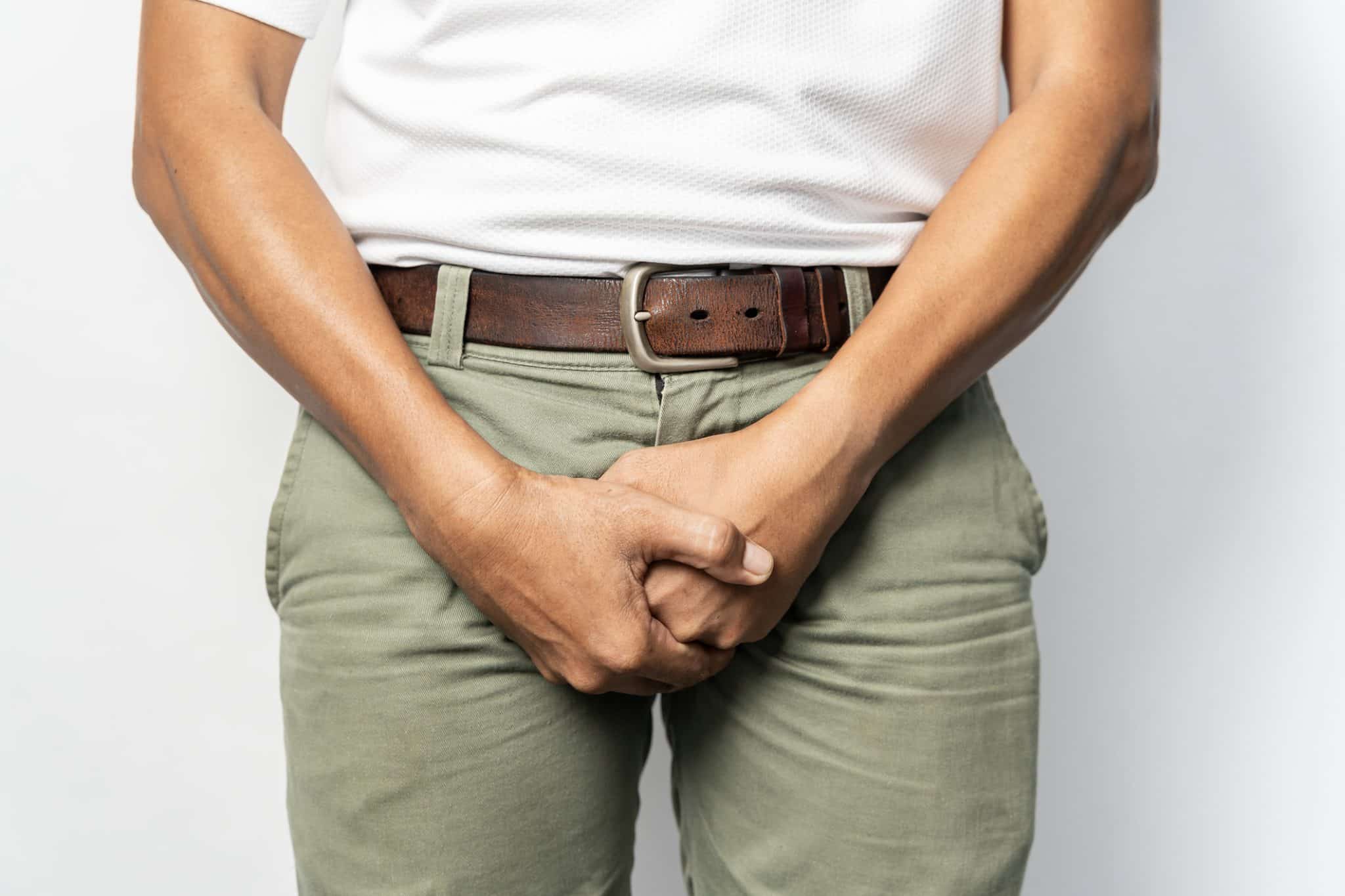 a man holding his privates suffering from genital eczema
