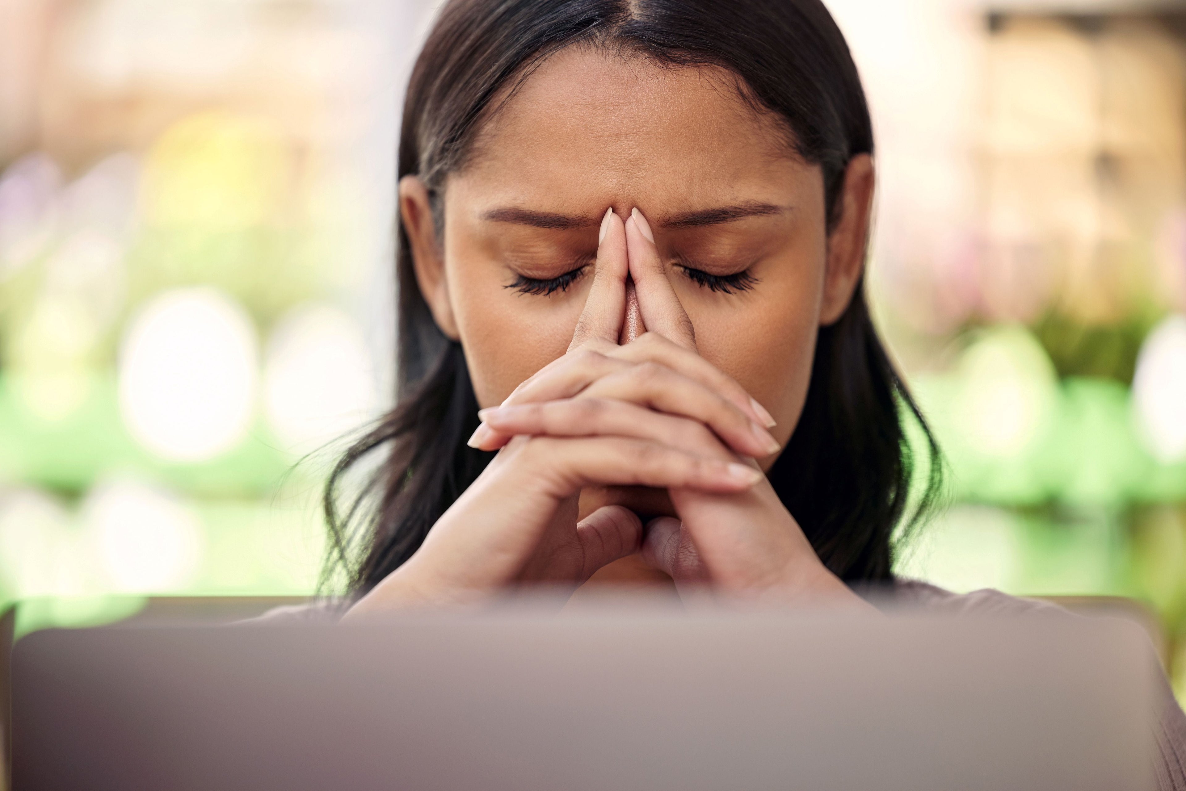 photo of a woman suffering with stress