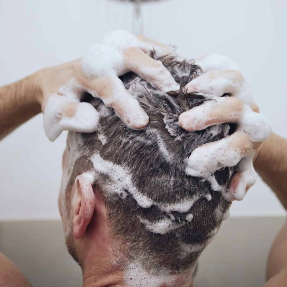 A man washing his hair
