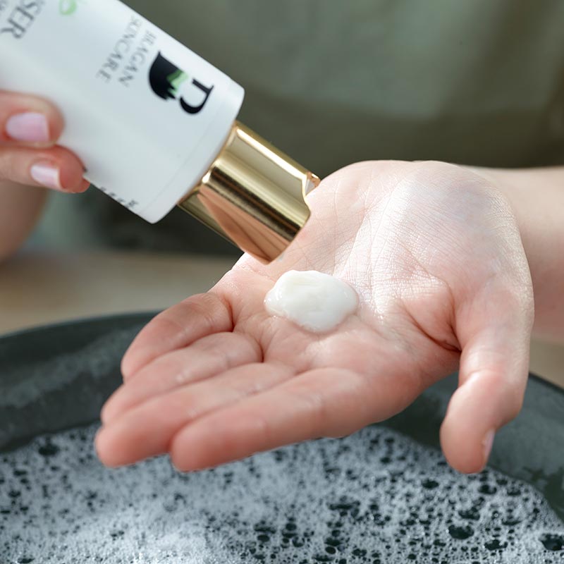 Woman applying Gentle Cleanser to her palm