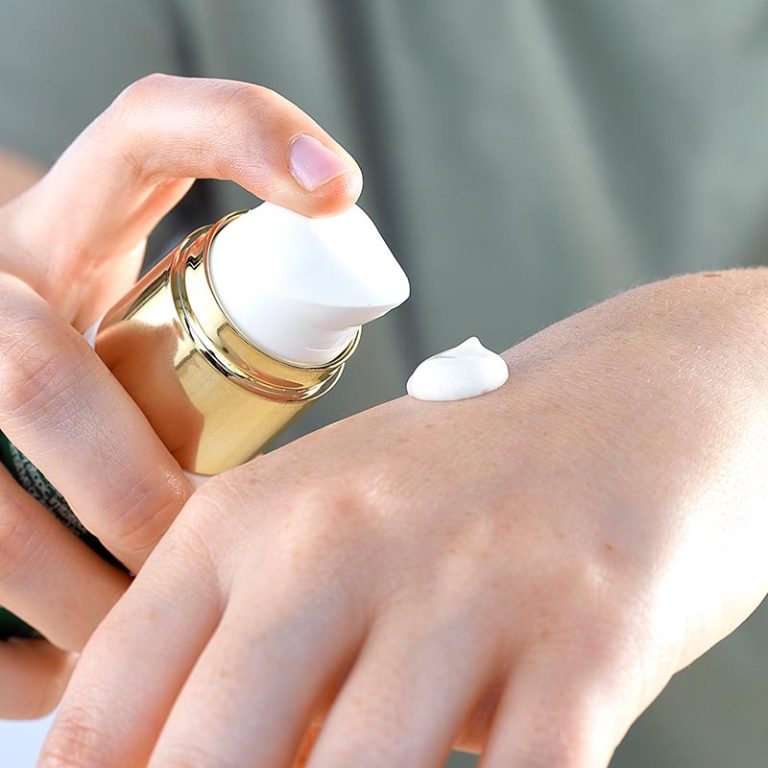 psoriasis treatment, nail and hand cream, Lady applying hand Cream
